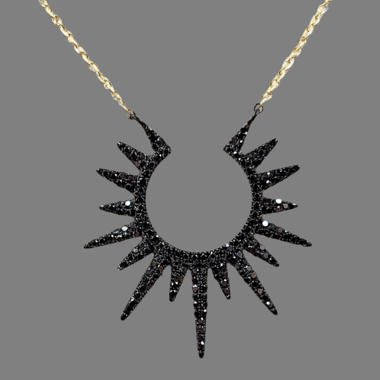Black diamond sunburst pendant