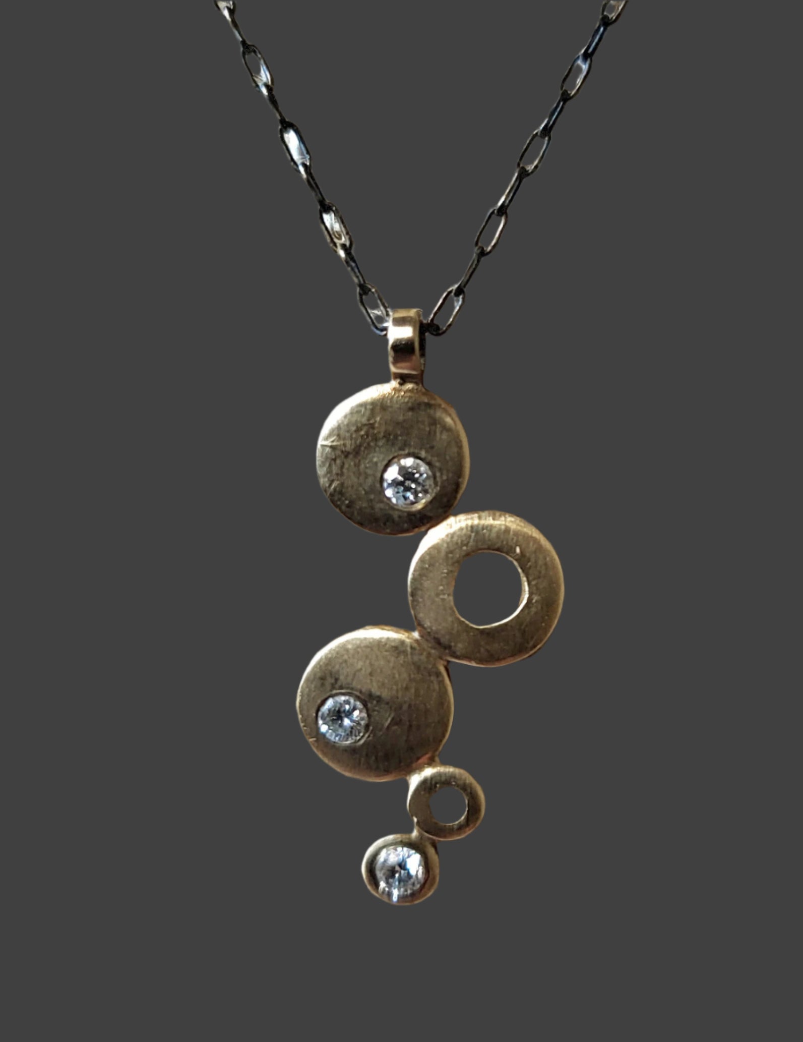 Gold and Diamond graduated disc pendant