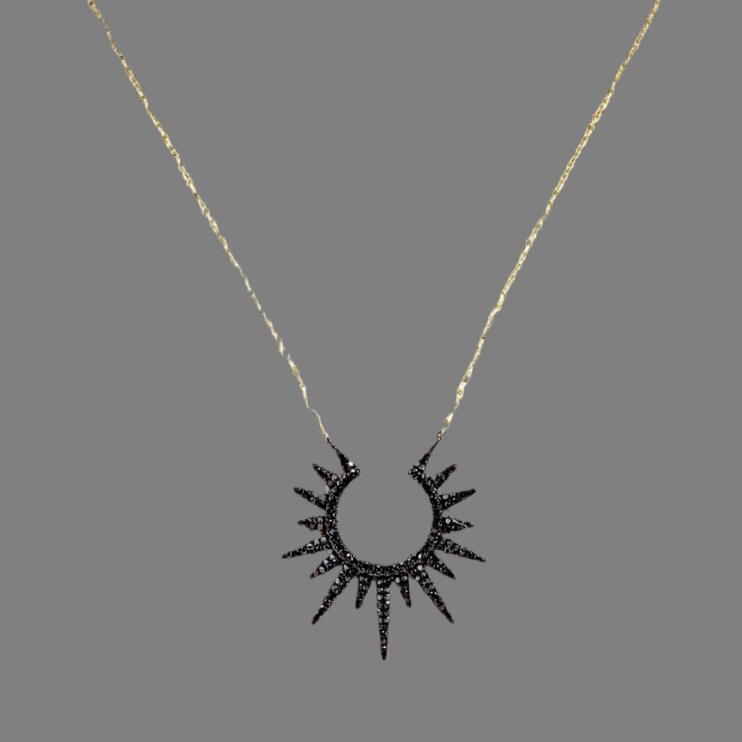 Black diamond sunburst pendant